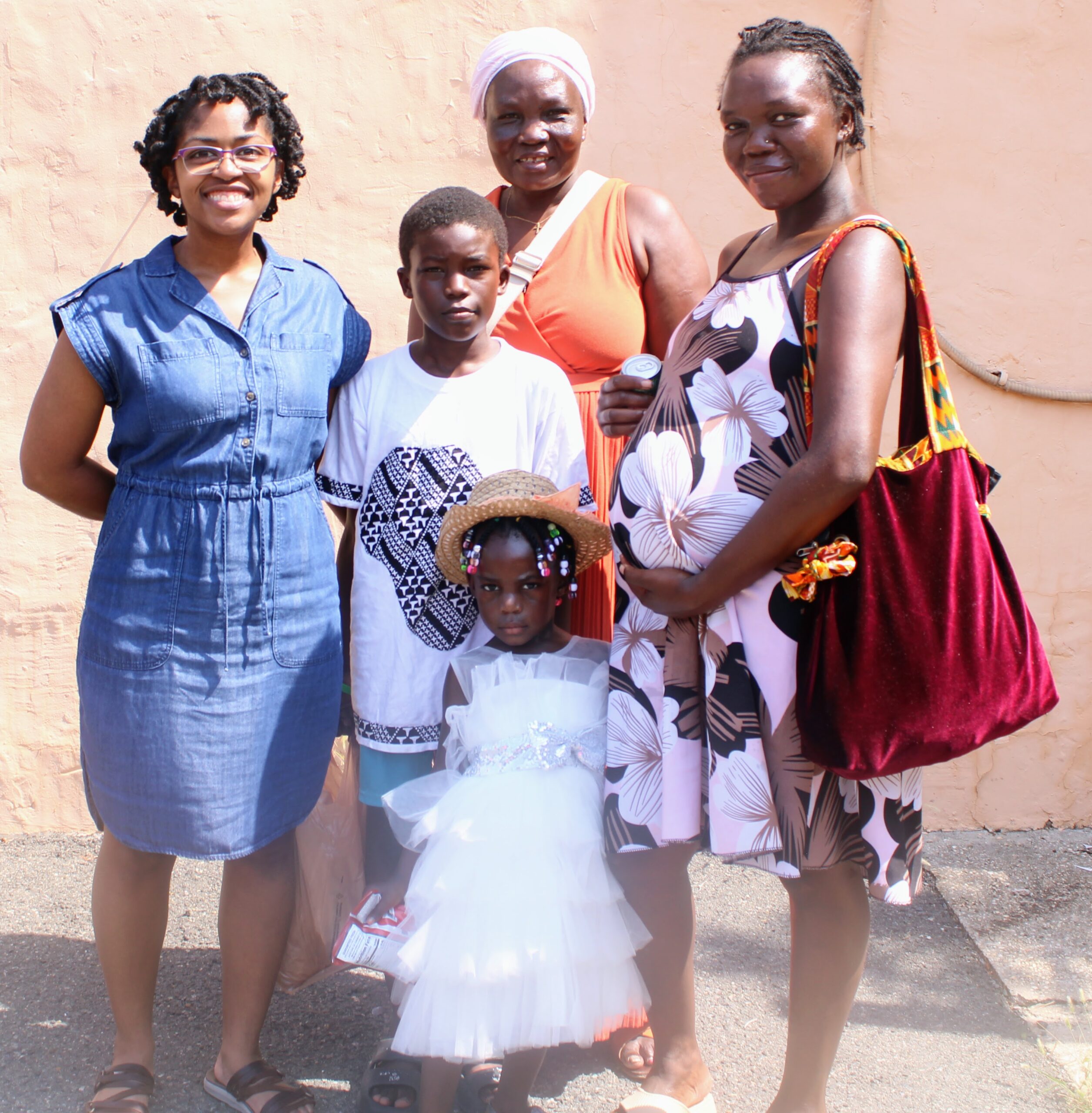 A father and mother holding their young child at a Platform of Hope gathering